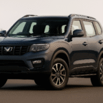 Mahindra Scorpio N 2025 SUV front and side view, parked outdoors showcasing bold design, LED headlights, muscular stance, and premium alloy wheels