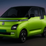 MG Comet EV 2025 – Compact electric city car in bright green color with LED strip and futuristic design, photographed in urban night background | Automobile9