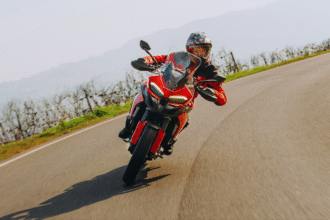 Ducati Multistrada V2 Launch in India 2025 – High-resolution image of the new Ducati Multistrada V2 adventure touring motorcycle, featuring 890cc V-Twin engine, 18 kg lighter frame, premium red color design, and advanced touring features at ₹18.88 lakh.”