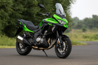 Kawasaki Versys 1100 Price hike-green adventure bike parked beside highway in daylight – 2025 model India