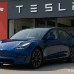 AI-generated image showing a Tesla electric car on a modern road during daytime, representing Tesla’s EV lineup in 2025. Disclaimer: This is an AI-generated image and may not accurately represent the actual vehicle.