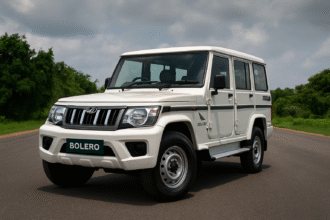 A high-resolution digital photograph showcasing the 2025 Mahindra Bolero in its new facelift design, featuring dual-tone body color and chrome front grille.