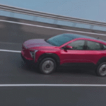 Mahindra XEV 9e Review-Mahindra XEV 9e electric SUV front view with LED DRLs and bold grille design.