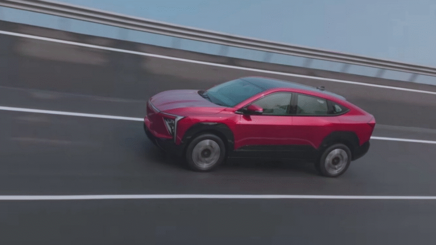 Mahindra XEV 9e Review-Mahindra XEV 9e electric SUV front view with LED DRLs and bold grille design.